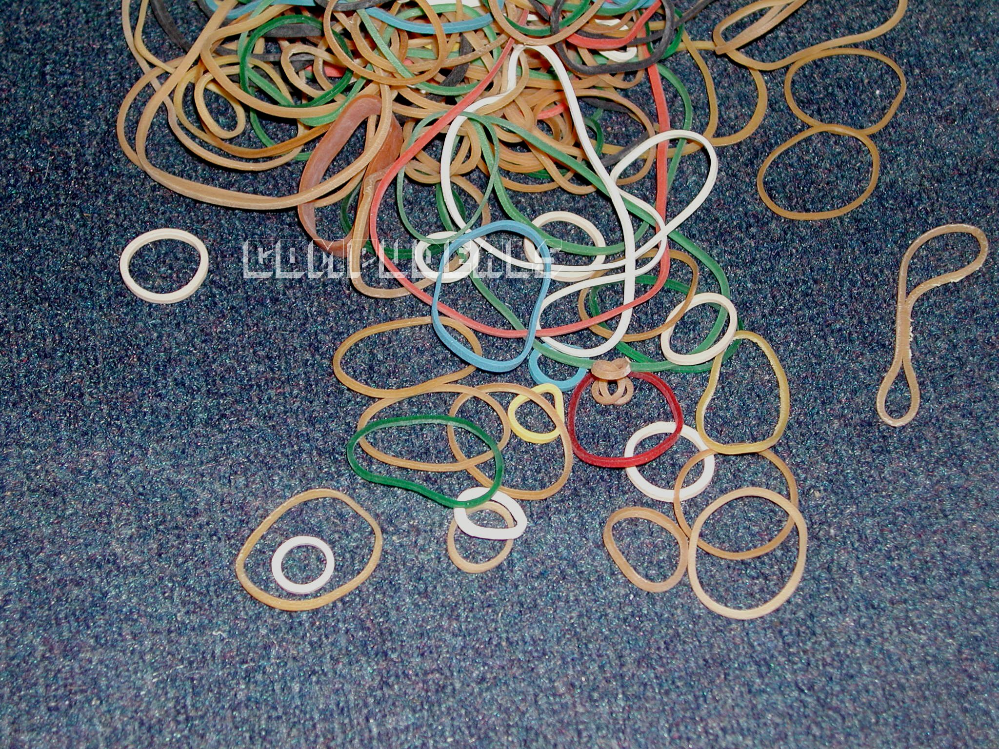 assorted rubber bands in various colors, sizes. 3 oz  .